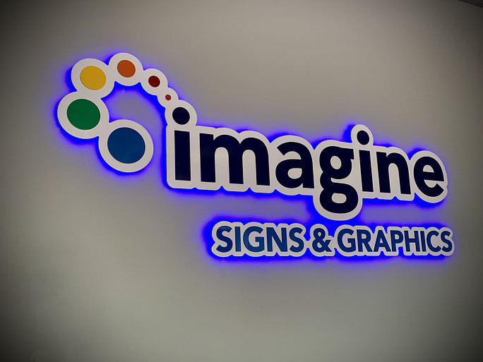 https://signsbyimagine.com/wp-content/uploads/2023/05/Imagine-Signs-Backlit-Halo-Office-Sign-1-1.jpg