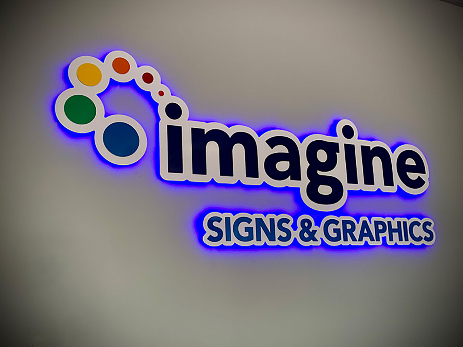 https://signsbyimagine.com/wp-content/uploads/2023/05/Imagine-Signs-Backlit-Halo-Office-Sign-1.jpg